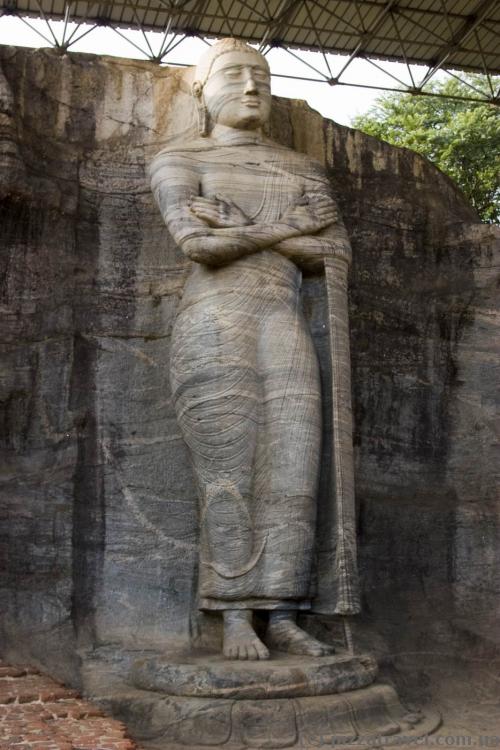 The standing image depicts an unusual mudra.