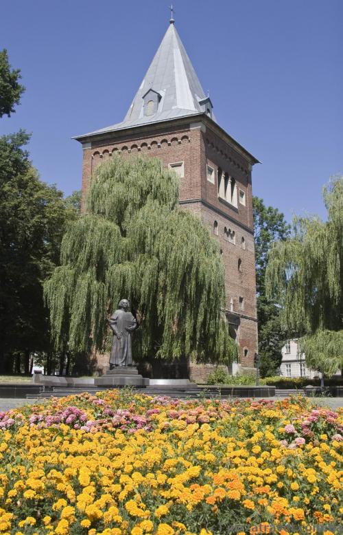 St. Bartholomew's Church bell tower and a monument to Yuri Drohobych